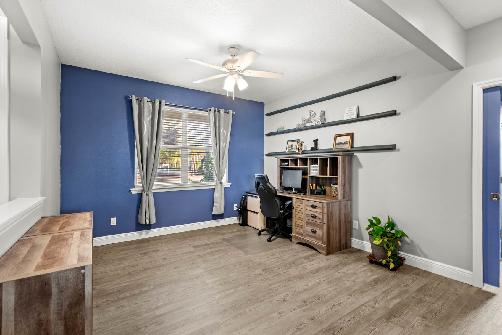office with desk and blue walls